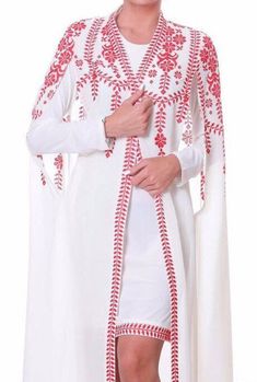 White Embroidered Dress With Cape Sleeves, Embroidered Cape Dress, White Traditional Dress With Cape Sleeves, White Long Sleeve Embroidered Wedding Dress, White Dresses With Cape Sleeves, Elegant White Kaftan With Floral Embroidery, Elegant White Floral Embroidered Kaftan, White Long Sleeve Dresses With Geometric Embroidery, White Resham Embroidery Kaftan For Wedding