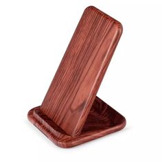 a wooden phone stand on a white background