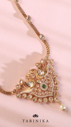 Embrace the magnificent allure of our pendant necklace featuring a peacock design embellished with dazzling CZ stones. This remarkable piece highlights the meticulous craftsmanship and intricate embellishments that breathe life into the peacock, capturing its elegance and grandeur. Piece Highlights, Peacock Pendant, The Peacock, South Indian Wedding, Cz Necklace, Peacock Design, Temple Jewellery, Cz Stone, Indian Wedding