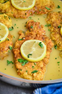 chicken with lemons and parsley in a pan