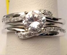 a white gold ring set with an oval cut diamond