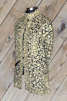 Short Kashmiri Jacket, Wedding Indian Jacket, Luxury Jacket A Kashmiri Jacket with All Over  Aari Embroidery (Front & Back) This Kashmiri jacket Makes you stand apart with its vivid colors and paisley embroidery, The base color is Black and Lemon Colour  Paisley-Aari Embroidery is done all over the jacket, the embroidery is done by brilliant Kashmiri artisans.  Embroidery      : Aari Work Length             : 40 Inches (101.6cms) [Customizable] Colour             : Black Base With Brown Embroide Designer Outerwear With Zari Work And Long Sleeves, Designer Long Sleeve Outerwear With Zari Work, Traditional Drape Outerwear With Zari Work For Reception, Long Sleeve Nehru Jacket With Intricate Embroidery For Reception, Designer Nehru Jacket With Chikankari Embroidery For Ceremonial Occasions, Gold Bandhgala With Bollywood Style Chikankari Embroidery, Fitted Nehru Jacket For Reception In Winter, Winter Bandhgala With Zari Work For Reception, Winter Reception Bandhgala With Zari Work