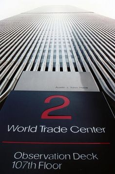 the world trade center observation deck sign in front of it's tall skyscrapers