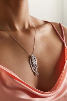 Garrard's necklace is designed to mimic the natural shape and delicacy of angel wings - each pendant is intricately crafted to move independently from another as they overlap. Cast from 18-karat white gold in an openwork design that brings "an ethereal lightness", they're illuminated with round-cut diamonds to accentuate their swooping curves and strung on an adjustable chain. Luxury Flower-shaped Diamond Necklace In Fine Jewelry Style, Elegant Jewelry Pendant With Angel Wings, Elegant Angel Wings Pendant Jewelry, Elegant Silver Wing-shaped Necklace, Elegant Silver Jewelry With Angel Wings, Elegant Silver Necklace With Angel Wings, Elegant Silver Angel Wings Jewelry, Elegant Angel Wings Necklaces, Elegant Silver Wing-shaped Jewelry