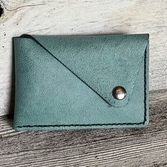 Color: Turquoise Material : Leather Approx Size: 4 X 2.5 Inches Blue Rectangular Leather Coin Purse, Blue Leather Rectangular Coin Purse, Light Blue Wallet With Card Slots For Everyday Use, Blue Bifold Coin Purse For Gift, Everyday Green Coin Purse With Coin Pocket, Blue Pouch Wallet As Gift, Blue Everyday Coin Purse With Card Slots, Blue Pouch Wallet For Gift, Green Bifold Coin Purse For Everyday Use