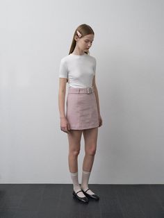 This product, the Janie Belted Skirt, is designed to offer a sleek and stylish addition to any fashion-forward wardrobe. The skirt's A-line cut is flattering on a variety of body types, and the included belt cinches at the waist for an added touch of elegance. With its clean lines and minimalist design, this skirt is a versatile piece that can be dressed up or down. - The Janie Belted Skirt features an A-line cut that gracefully complements the figure.- It comes with a matching belt that highlights the waist and adds a sophisticated detail.- The skirt is secured with a discreet back zipper, allowing for a seamless and comfortable fit.- Constructed with a smooth, lightweight fabric, it provides a comfortable wear suitable for different seasons. Belted Fitted Mini Skirt, Fitted Belted Mini Skirt, Fitted Mini Skirt With Belt, Elegant Belted Skort, High Waist Fitted Belted Skort, Chic Fitted Skirt With Belt, Fitted Mini Skirt With Belt Detail, Fitted Belted Pencil Skirt, Fitted Belted Mini Skort