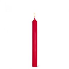 a red candle is lit on a white background