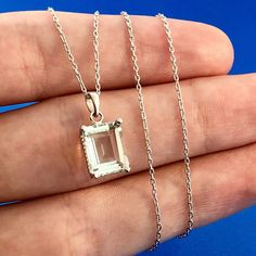 * 14K White Gold Emerald Cut Green Topaz Solitaire Drop Pendant Necklace * Link Chain length: 18" * Link Chain Width: 1/16" * Link Chain marked : ARR 14K * Link Chain weight: 1.7 g * Pendant Length: 1/2" * Pendant Width: 3/8" * Emerald Cut Green Topaz measures: approximately 10.0 mm x 8.0 mm  * Pendant Weight: 1.5 tgw * Marked: Mexico 14K * Total necklace weight: 3.2 tgw * Condition: As pictured. * G327    Exported By ExportYourStore :) Green Topaz, Drop Pendant Necklace, Emerald Cut, Drop Pendant, Emerald, Topaz, Favorite Jewelry, Necklace Etsy, Jewelry Necklace Pendant