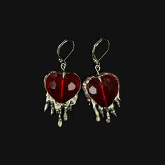 Handmade earrings with brilliant red crystal hearts and soft solder details. Inspired by the heavily encased jewels in metalwork of the Middle Ages, these reference the motif of the bleeding heart, and popular jewelry styles of the period. Hypoallergenic silver plated french earring hooks Made to order; will be unique and vary from product photo Silver Red Jewelry, Pierced Metal Jewelry For Valentine's Day, Sterling Silver Heart Jewelry For Party, Sterling Silver Double Heart Jewelry For Party, Gothic Heart Charm Jewelry For Parties, Gothic Heart-shaped Pierced Jewelry, Gothic Party Jewelry With Heart Charm, Pierced Metal Heart Pendant Jewelry, Pierced Heart Pendant Jewelry