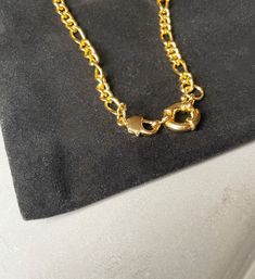 A beautiful figaro chain style necklace featuring a large spring ring clasp (which can be worn to the front or back), 14k gold plating and a high polish finish Gold Plated Figaro Chain Link Jewelry, Gold-plated Figaro Chain Link Jewelry, Gold-tone Figaro Chain Jewelry With Oval Link, Gold-tone Oval Link Figaro Chain Jewelry, Yellow Gold Plated Jewelry With Figaro Chain, Gold Plated Figaro Chain Jewelry With Oval Link, Gold Plated Figaro Chain With Oval Link, Yellow Gold Metal Jewelry With Figaro Chain, Yellow Gold Figaro Chain Jewelry