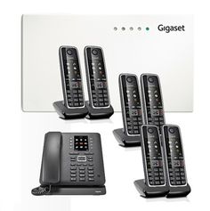 four black cordless phones sitting next to each other on a white box with the words gigset above them