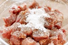 meat in a bowl with powdered sugar on top