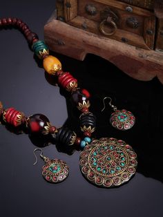 Introducing our exquisite Traditional Tibetan Pendant Necklace Jewellery Set, a captivating blend of cultural richness and timeless elegance. Inspired by the intricate artistry of Tibet, this stunning set is meticulously handcrafted by skilled artisans to bring you a piece of heritage and beauty. The centerpiece of this set is a breathtaking pendant, fashioned with utmost care and attention to detail. Crafted from premium quality materials, the pendant features traditional Tibetan motifs and symbols, each carrying its own meaningful significance. These symbols are believed to bring blessings, protection, and harmony to the wearer, making this necklace not just a piece of jewellery but also a token of positivity and spirituality. The pendant gracefully hangs from a delicate yet durable chai Oxidized Silver Necklace, Fashion Jewellery Online, Traditional Jewellery, Care Care, Indian Necklace, Bollywood Jewelry, Statement Choker Necklace, Party Kleidung, Antique Necklace