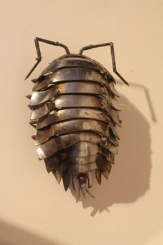 a metal bug with spikes attached to it's back