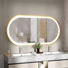 a bathroom with two sinks and a large mirror