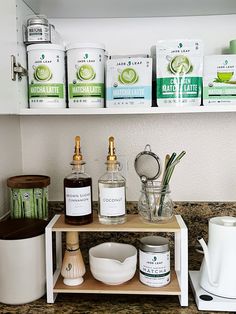 the shelf in the kitchen is filled with different types of spices and condiments