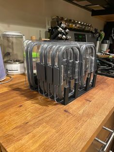 several knives are stacked on top of each other in the middle of a kitchen counter