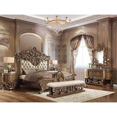 an ornate bedroom with gold furniture and chandelier