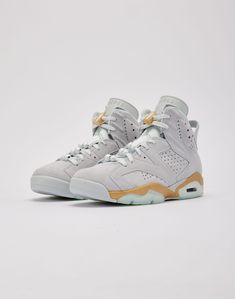 The Air Jordan 6 “Pearl” features a sophisticated "Pure Platinum" suede upper that's soft to the touch. The monochromatic look extends to the matching "Pure Platinum" tongues, laces, and heel tabs. However, what truly sets this sneaker apart are the pearl-inspired charms adorning the laces. Suede upper Suede overlays P Air Jordan 6 Retro, Jordan 6 Retro, Graphic Tee Outfits, Jordan Air, Womens Jordans, Air Jordan 6, Jordan 6, Tee Outfit, Boy Shoes