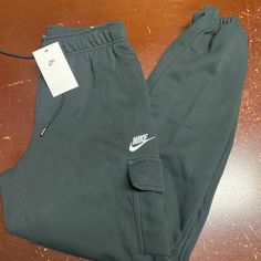 Nike Womens Black Sportswear Essentials Mid Rise Loose Fit Cargo Pants Size S Xl Brand: Nike Department: Women Size: S, Xl Color: Black Type: Pants Style: Cargo Pattern: Solid Theme: Sports Occasion: Activewear Season: All Season Features: Elastic Waist, Pockets Condition: New With Tags I Offer Discounts For All Return Customers. - Jvs Nike Athleisure Cargo Pants With Cargo Pockets, Nike Cargo Pants With Cargo Pockets Athleisure Style, Nike Athleisure Cargo Pants With Pockets, Nike Cargo Pants For Athleisure, Nike Sporty Pants With Pockets, Casual Nike Cargo Pants With Hip Pockets, Nike Athleisure Cargo Pants, Nike Sporty Cargo Pants With Pockets, Nike Sporty Cargo Pants