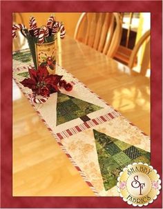 a christmas table runner is on sale for $ 59 99 at ebay com, with the price tag below it