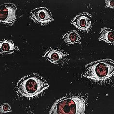 an image of many red eyes in the dark