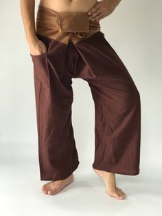 "Unisex Thai fisherman pants. One size fits all. You can wear in many occasions, casual wear, yoga wear, maternity wear, relax at home, travel etc. If you are looking for some pants that you can wear everywhere, comfortable, relax and Easy to wear. Thai fisherman pants is Answer!! Nice gift for yourself or your lover One pocket on the side for storing your items such as wallets, mobile phones, etc Approx. Measurements: One size can fits most and 1 Pockets Measurement Waist 27\" (69 cms) Length 4 Baggy Brown Bottoms With Tapered Leg, Baggy Brown Tapered Leg Bottoms, Brown Baggy Tapered Leg Bottoms, Brown Straight Parachute Pants With Side Pockets, Brown Relaxed Fit Pants With Pockets, Brown Leather Pants With Pockets, Baggy Brown Harem Pants With Pockets, Brown Relaxed Fit Parachute Pants, Brown Relaxed Fit Parachute Trousers