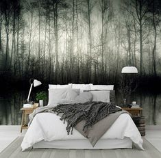 a bedroom with a large wall mural in the background and a bed on the floor