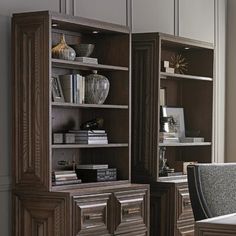 a wooden bookcase sitting next to a window