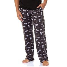 These lounge pants are adorned with images of all nine iconic film logo titles and various legendary spaceships from the movies, including the Millennium Falcon and the X-Wing. Each design is meticulously crafted to capture the essence of the Star Wars saga, making these pajama pants an authentic tribute to the epic space opera. Made from a premium blend of 95% polyester and 5% spandex, these pajama pants offer a soft and smooth feel against the skin. The fabric provides just the right amount of Movie Logos, Mens Pyjama Bottoms, Star Wars Pajamas, The Millennium Falcon, Film Logo, Mens Pajama Pants, Man Movies, X Wing, Millennium Falcon