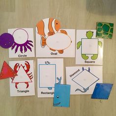 several different types of cut outs on a table with paper and scissors to make them look like sea animals