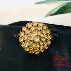 Tyaani Inspired Pacchi Kundan Golden Adjustable Ring Features: Adjustable Ring to match any finger size 22 Karat Gold Finish Lightweight Jewelry Made in Brass with very high quality Kundan stones Suitable for any occasion and traditional or Modern attire Ready to ship and available for local pickup from 23059. Please message us for more details Free shipping on orders above $75 within USA. Light Weight Jewelry, Adjustable Ring, Adjustable Rings, Gold Finish, Cubic Zirconia, Jewelry Making, Brass, Ring, Stone