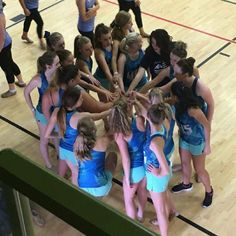 a group of girls huddle together in a circle