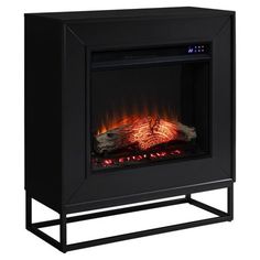 an electric fireplace that is black and has flames on the front, side and sides