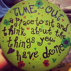 a green plate with writing on it that says, time out a place to sit and think about the things you have done