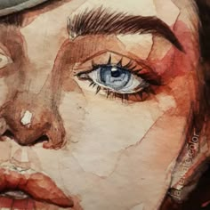 a watercolor painting of a woman's face with blue eyes