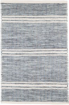 a blue and white rug with lines on the bottom, in different sizes and colors