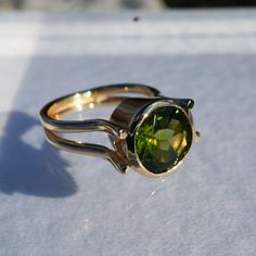 14K solid yellow gold ring by ICCHA with 10mm round peridot.  Size 5.75. Peridot Round Birthstone Ring For Formal Occasions, Formal Round Peridot Birthstone Ring, Formal Peridot Birthstone Ring, Formal Rings With Polished Peridot, Yellow Gold Solitaire Peridot Rings, Yellow Gold Peridot Solitaire Rings, Round Peridot Jewelry With Polished Finish, Yellow Gold Peridot Solitaire Birthstone Ring, Formal Peridot Rings With Polished Finish