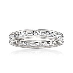 a white gold wedding band with baguettes and diamonds on the sides, set in 18k white gold