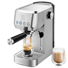 an espresso machine with two cups of coffee next to it on a white background