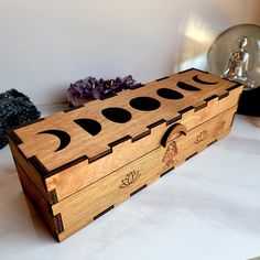 a wooden box sitting on top of a table