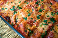 a casserole dish with meat and cheese on it