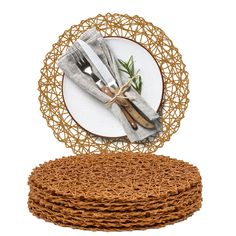 a stack of twine wrapped plates with forks and knives on them in front of a white background