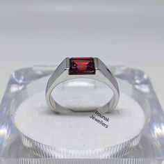 BAND - ROUNAK JEWELLERS MATERIAL - 925 STERLING SILVER GEMSTONE - 100% NATURAL GARNET GARNET STONE WEIGHT - 1.60 CT, STONE SIZE - 7 x 5 MM GROSS WEIGHT - 4.550 GM STONE SHAPE - EMERALD GEM COLOUR - RED RING SIZE- ALL SIZE AVAILABLE PLEASE GIVE YOUR OPENION OR FEEDBACK ABOUT THE PRODUCT. WE ACCEPT BULK ORDER ALSO. https://www.etsy.com/in-en/shop/RounakJewellers?ref=search_shop_redirect Modern Sterling Silver Ruby Ring For Anniversary, Modern Topaz Ring With Round Band, Sterling Silver Promise Ring With Rectangular Stone, Adjustable Formal Ruby Gemstone Ring, Modern Sterling Silver Birthstone Ring For Formal Events, Modern Sterling Silver Birthstone Ring For Formal Occasions, Promise Ring With Polished Finish And Rectangular Stone, Rectangular Stone Promise Ring With Polished Finish, Modern Sterling Silver Rings With Rectangular Stone