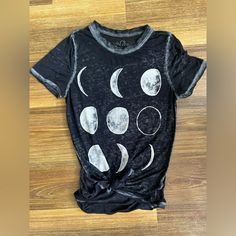 Size Xs Women’s Tee With The Moon Phases On The Front. Very Light Material. Back Is Longer Than The Front And The Material Is Semi See Through. I’ve Had The Tee With The Knot In The Front! Excellent Condition! Cotton Summer Tops With Moon Print, Summer Moon Print Crew Neck Top, Cotton Crew Neck Top With Moon Print, Trendy Moon Print Crew Neck Top, Fitted Moon Print Crew Neck Top, Black Summer Top With Moon Print, Trendy Crew Neck Top With Moon Print, Casual Crew Neck Top With Moon Print, Fitted Black Tops With Moon Print