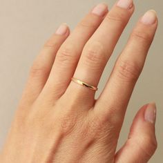 A simple 2mm gold band crafted in 14k yellow gold, for all your stacking needs. Wear it solo, as a simple vow ring, or stacked playfully with our other gold ring options. Either way, you can't go wrong. This style is made to order and will take 2-3 weeks to ship. Crafted in San Francisco using ethically sourced materials. *All sales are final* Minimalist Thick Gold Band, Stackable Thick Yellow Gold Band, Simple Tiny Yellow Gold Stackable Rings, Minimalist 14k Gold Thick Band, Minimalist 14k Gold Thick Band Stackable Rings, Gold Wedding Rings For Women, Simple Wedding Bands, Persian Motifs, Ring Crafts