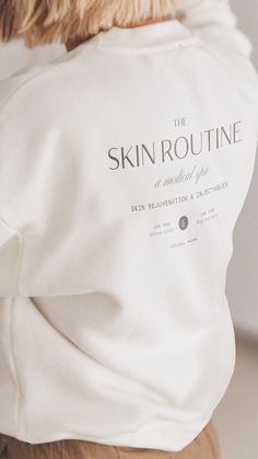 the back of a woman's white sweatshirt that says skin routine