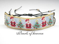 a beaded bracelet with red, green and blue beads on it's side