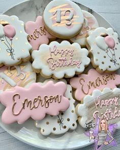 decorated cookies on a plate with happy birthday words and balloons in the middle for someone's 13th birthday