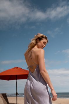 The Jenny Yoo Leilani slip dress is a chic and modern update to the classic slip dress. Featuring a V neck and a delicate spaghetti strap to highlight your shoulders and collarbone. The low scoop back has a barely there feeling, and the bias cut skirt slinks over every curve. A dainty tie at the back adds one last flirtatious detail. Available in Clay Rosette Pink and Oxford Blue. Ready to ship. Shop online now! Fitted Tie Back Slip Dress For Date Night, Fitted Slip Dress With Tie Back For Date Night, Vacation Dresses With Spaghetti Straps And Built-in Bra, Spring Dress With Built-in Bra And Strappy Back, Fitted Slip Dress With Tie Back For Brunch, Chic Fitted Tie Back Slip Dress, Fitted Tie-back Slip Dress For Brunch, Elegant Summer Halter Dress With Back Opening, Chic Fitted Slip Dress With Tie Back